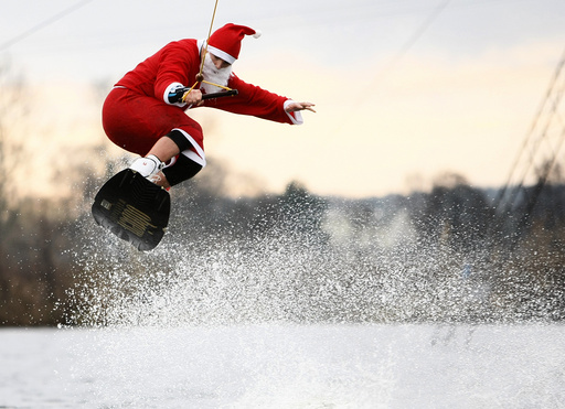 A man dressed as Santa Claus wakeboards in Hamburg