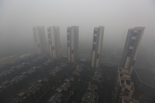 Residential buildings are seen shrouded in haze in Shenyang