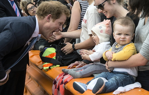 Britain's Prince Harry meets young members of the public during a walkabout tour of Christchurch's city mall in New Zealand