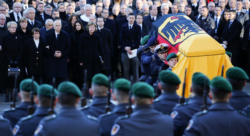 German army Bundeswehr soldiers carry the coffin holding the body of late former West German Chancellor Schmidt after the memorial service in St. Michael's Church in Hamburg