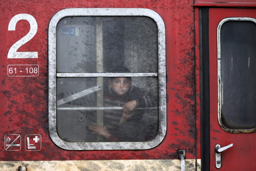 A migrant looks out of a train window near the Macedonian-Greek border in Gevgelija