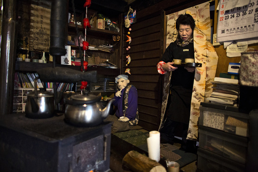Tsukimi Ayano serves tea in her house in the village of Nagoro