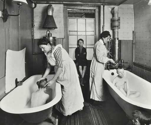 Attendants bathing boys at the Central Street Cleansing Station, London, 1914. Artist: Unknown.