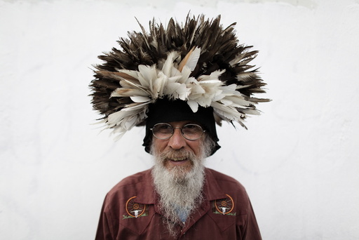 Moreno poses for a photograph with a wig made with pigeon feathers in downtown Monterrey