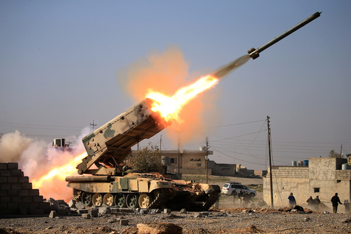 Iraqi army launch a rocket towards Islamic State militants during a battle with Islamic State militants near Ghozlani military complex, south of Mosul