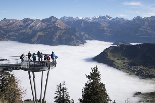 Day-trippers enjoy the sunny weather on the Stanserhorn