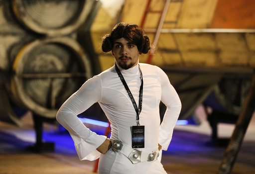 Star Wars fan Josh Lynch, dressed as Princess Leia poses for a photograph in front of an X-wing fighter at the 'For The Love of The Force' fan convention in Manchester , northern England