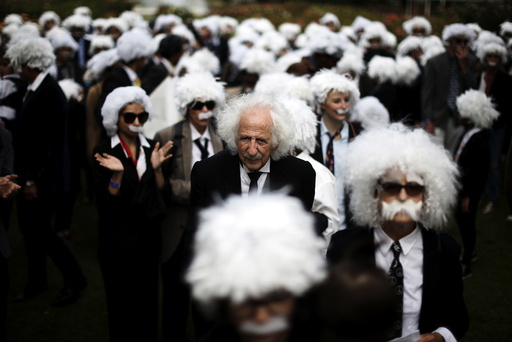 Benny Wasserman, stands with others dressed as Albert Einstein as they gather to establish Guinness world record for largest Einstein gathering, to raise money for School on Wheels and homeless children's education, in Los Angeles