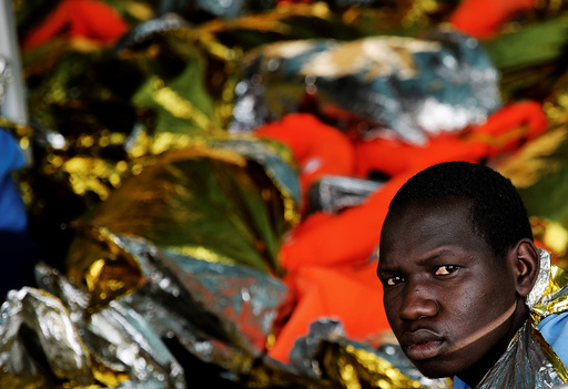 A migrant looks on onboard the former fishing trawler Golfo Azzurro after he was rescued along with other migrants by the Spanish NGO Proactiva Open Arms as the raft he was on drifted out of contol in the central Mediterranean Sea