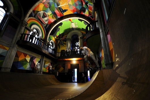 A man practises skateboarding inside the desconsecrated Santa Barbara church in Llanera, northern Spain
