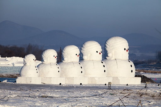 Giant snow sculptures in the shape of Russian traditional Matryoshka dolls are displayed at a tourist resort in Jilin