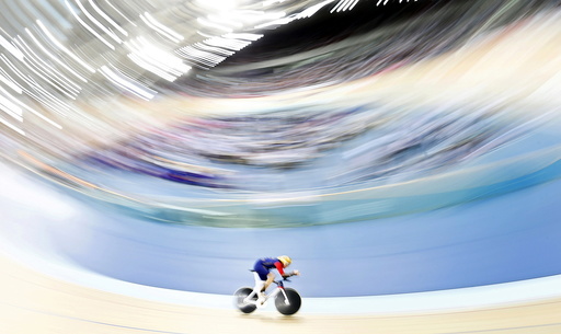 Bradley Wiggins pedals during his attempt to break cycling's hour record at the Olympic velodrome in East London, Britain
