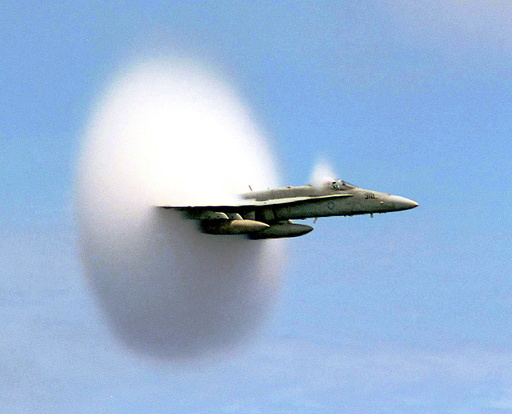 Handout file photo shows Lieutenant Ron Candiloro, assigned to Fighter Squadron One Five One, breaking the sound barrier in an F/A-18 Hornet fighter plane