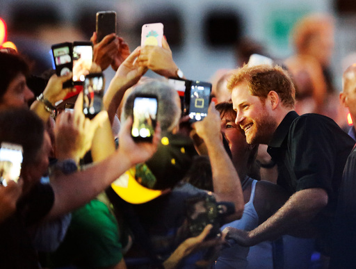 Britain's Prince Harry greets the public as he arrives for the Invictus Games Foundation reception at the CN Tower in Toronto