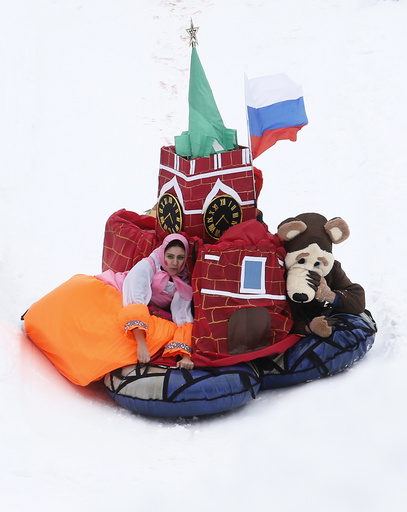 Participants compete during a contest on the longest distance and the most creative performance at the 'Battle sani' festival of self-made sledges in Moscow