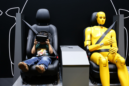 A young boy watches a virtual drive at the Toyota booth at the Frankfurt Motor Show (IAA) in Frankfurt