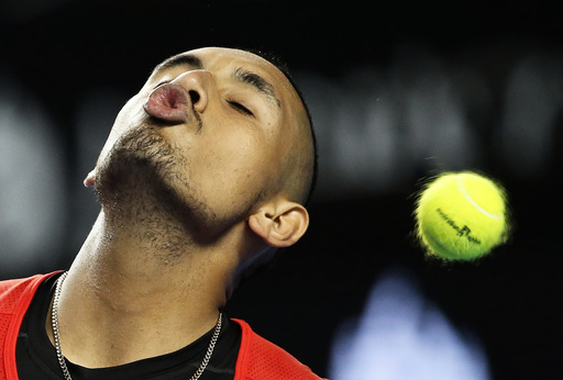 Australia's Kyrgios tries to kiss the ball as it flies past during his second round match against Uruguay's Cuevas at the Australian Open tennis tournament at Melbourne Park
