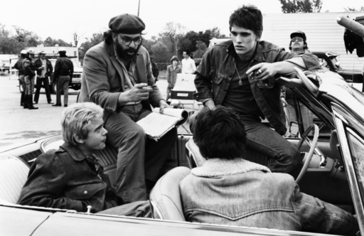 THE OUTSIDERS, front: C. Thomas Howell; back: director Francis Ford Coppola, Matt Dillon, on set, 19