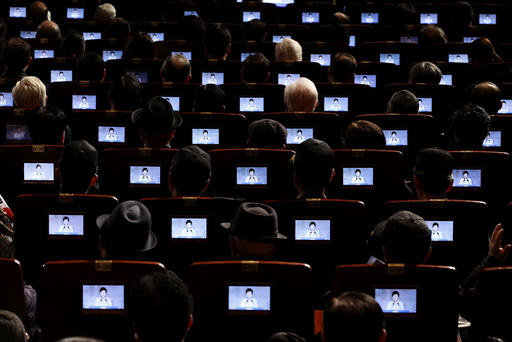 South Korean President Park Geun-hye is seen on small screens fitted in seats as she delivers a speech during a ceremony celebrating the 97th anniversary of the Independence Movement Day in Seoul