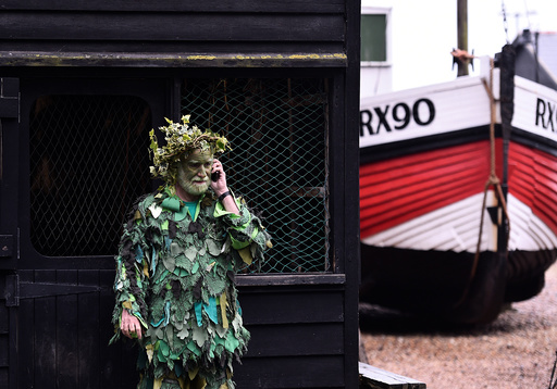 A participant takes part in the annual Jack In The Green parade in Hastings