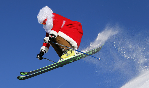 A freerider dressed in Santa Claus costume, ski teacher Ronchi jumps in Madonna di Campiglio