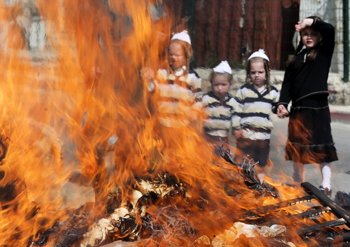 Ultra-Orthodox Jewish boys burn leaven in the Mea Shearim neighbourhood of Jerusalem ahead of the Jewish holiday of Passover