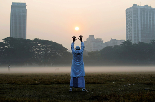 A man exercises in a park on a winter morning in Kolkata