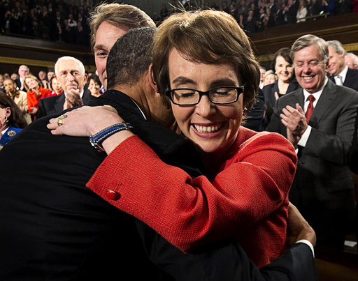 U.S. President Barack Obama hugs Representative Giffords prior to his State of the Union address to a joint session of Congress on Capitol Hill in Washington,