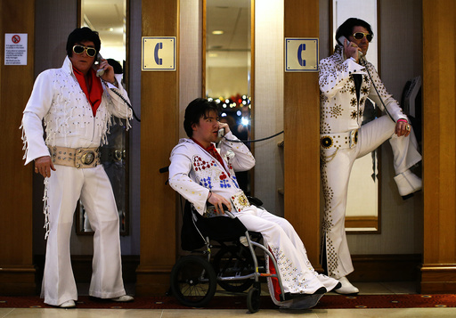 Amateur contestants pose in telephone booths during the annual European Elvis Tribute Artist Contest and Convention in Birmingham