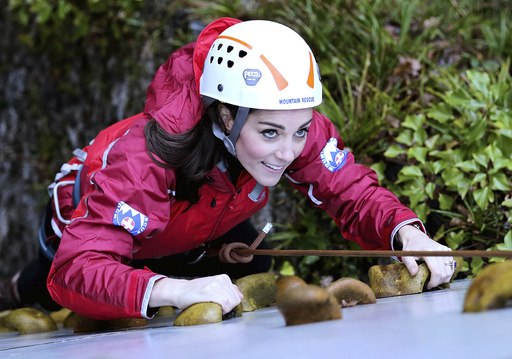 Britain's Catherine, Duchess of Cambridge, ascends a climbing wall as she visits the Towers Residential Outdoor Education Centre in Capel Curig