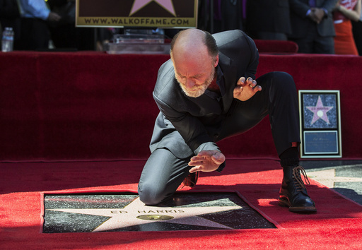 Actor Harris poses on his star after it was unveiled on the Hollywood Walk of Fame in Los Angeles