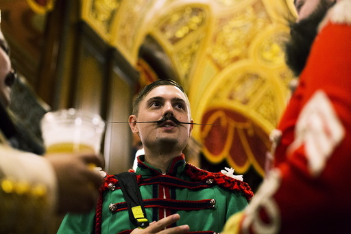 Contestants chat during intermission at the 2015 Just For Men National Beard & Moustache Championships at the Kings Theater in the Brooklyn borough of New York