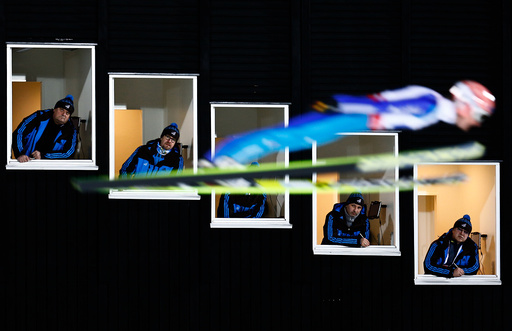 Freund of Germany soars past judges windows during the normal hill HS100 mixed team ski jumping event of the Nordic World Ski Championships in Falun