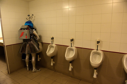 A reveller is seen in the bathroom during carnival celebrations in Gijon