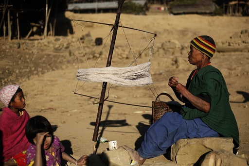 A Naga woman weaves using a traditional method in Yansi village, Donhe township in the Naga Self-Administered Zone