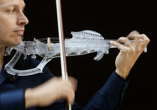 French engineer and professional violinist Laurent Bernadac plays a 3D printed violin in Paris