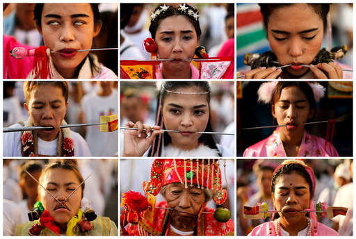 Devotees of the Chinese Jui Tui shrine are seen with spikes piercing their cheeks during a procession celebrating the annual vegetarian festival in Phuket