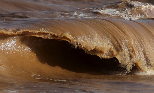 A wave is pictured on the sea near the mouth of Rio Doce, which was flooded with mud after a dam owned by Vale SA and BHP Billiton Ltd burst, as the river joins the sea on the coast of Espirito Santo in Regencia Village, Brazil