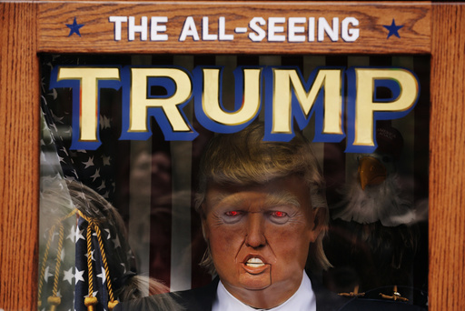 The likeness of Donald Trump stands inside of a themed fortune telling machine in Columbus Circle in New York