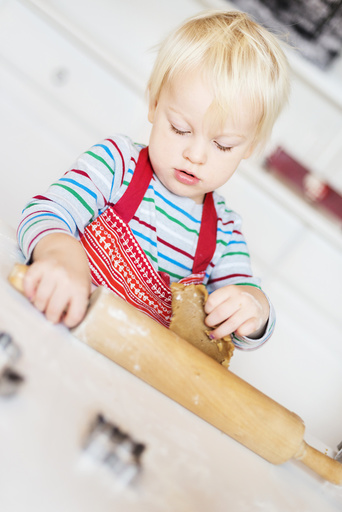 Boy making cookies at home