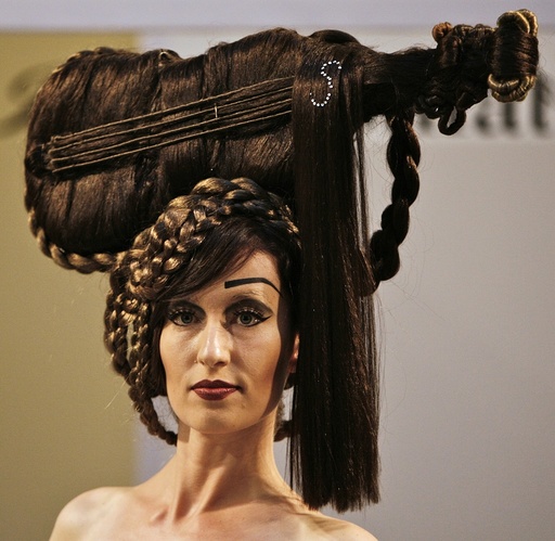 Model presents a creation during a hair show in Budapest