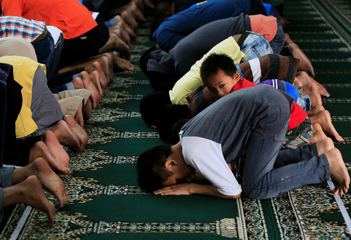 Muslims pray inside a mosque during their noon prayer a few days after President Rodrigo Duterte announced the liberation of their town from pro-Islamic State militant groups in Marawi city