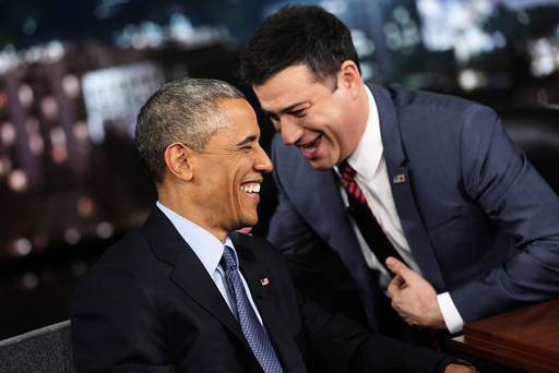 Obama laughs with show host Jimmy Kimmel during a commercial break in a taping of Jimmy Kimmel Live in Los Angeles