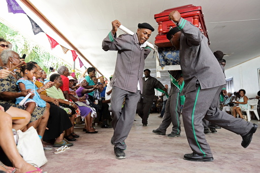 Surinamese pallbearers compete in a song and dance contest in Paramaribo