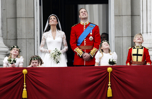 Britain's Prince William and his wife Catherine, Duchess of Cambridge, watch the fly past as they stand on the balcony at Buckingham Palace after their wedding in Westminster Abbey, in central London