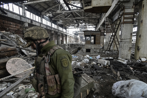 Ukrainian serviceman guards an area on front line at industrial zone of Avdiyivka