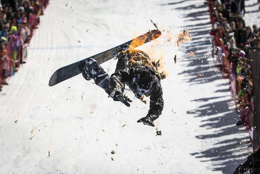 A snowboarder performs during the Red Bull Jump and Freeze competition at ski resort Shimbulak