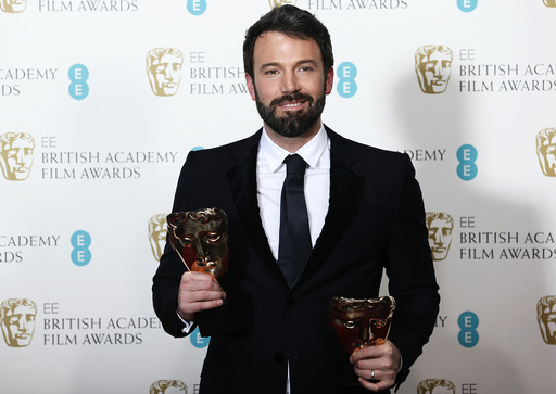 Affleck celebrates after winning the Awards for Best Film and Best Director at British Academy of Film and Arts awards ceremony in London