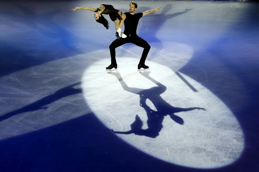 Madison Chock and Evan Bates of the U.S perform at an exhibition event for China ISU Grand Prix of Figure Skating in Beijing