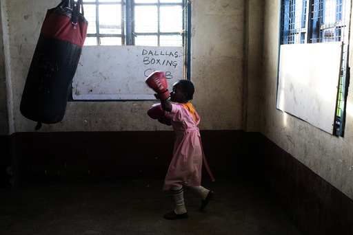 A girl practices boxing at a local gym for disadvantaged youth in Kamukunnji